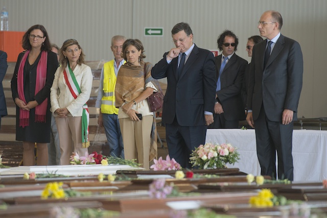 LAMPEDUSA VISIT. European Union President Jose Manuel Barroso (C), Lampedusa's mayor Giusy Nicolini (2-L) with Italy's Prime Minister Enrico Letta (R) and European Home Affairs Commissioner Cecilia Malmstroem (L), stand next to the coffins during their visit to an airport hangar in Lampedusa, Italy, 09 October 2013. EPA/Roberto Salomone/European Commission