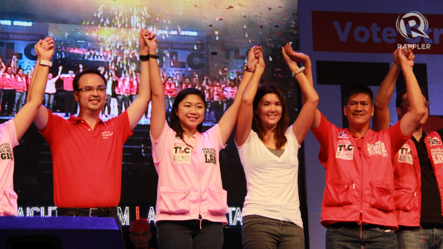Confident Cayetanos. Alan Peter, his wife and sister triumphantly raise their hands at the end of a miting de avance in their home court of Taguig. Lani Cayetano calls their last political rally a "dry run for their victory party." Photo by Rappler/Katherine Visconti
