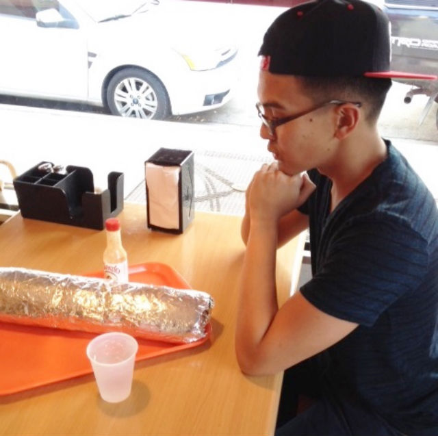 MONSTER BURRITO. The author sizing up the challenge. All photos courtesy of Lawrence Ochoa/The FilAm
