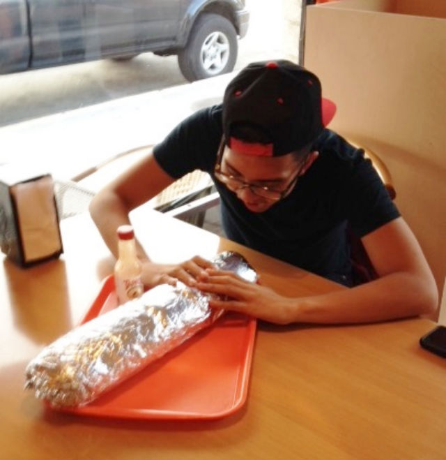 DIVING IN. Ochoa gets ready to devour the 6 pound burrito. 
