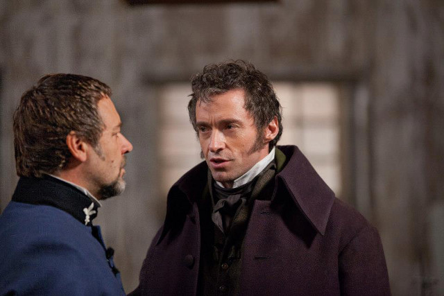Hugh Jackman's Jean Valjean (right) as Monsieur Madeleine