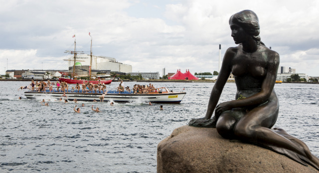 DENMARK'S PRIDE. One hundred women jump in the water in front of The Little Mermaid sculpture, a world-famous attraction, in Copenhagen, Denmark on Aug 23, 2013. File photo by Nikolai Linares/EPA
