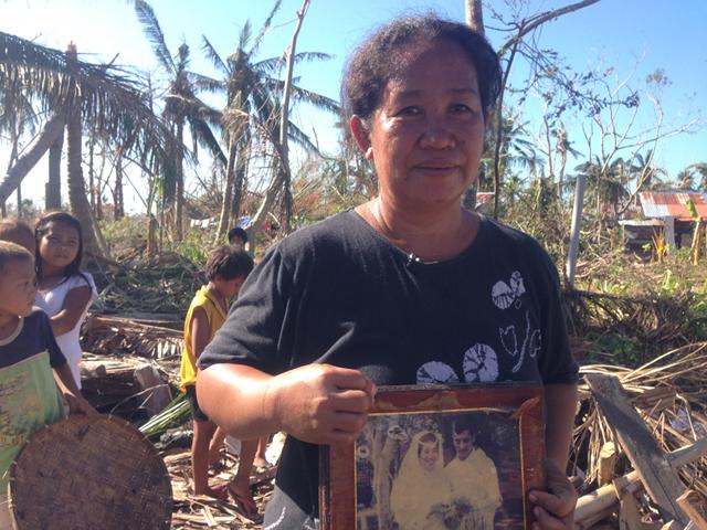 PRIZED POSSESSION. Amid the debris from what once was her home in Haiyan-hit Bantayan Island, Lorliza Batiancela finds a prized possession. Photo by Ayee Macaraig/Rappler