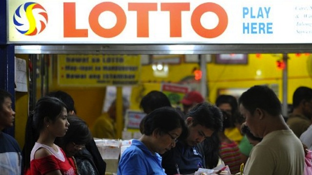 DISPUTE. PCSO and lottery equipment provider PGMC are in a dispute as the latter claims exclusive rights to lease lottery equipment in Luzon. AFP Photo