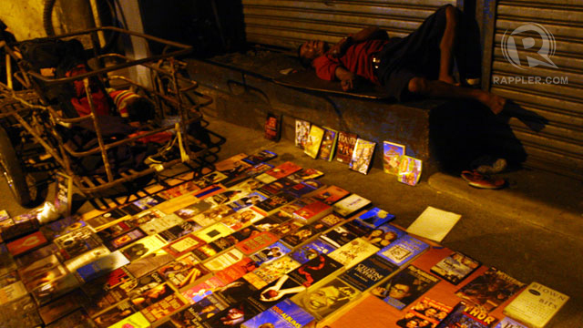FETE DE LA MUSIQUE staple: books and other forms of literature were peddled along the sidewalk. The homeless man seemed out of place.