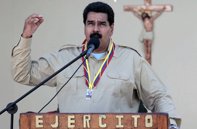 'YANKEES GET OUT!' Venezuelan President Nicolas Maduro delivers a speech during a meeting with members of the national army in Falcon state, Venezuela on September 30, 2013. AFP/Venezuelan Presidency
