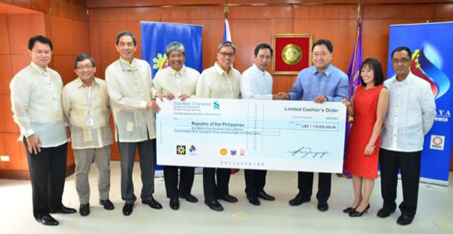 TURNOVER. Ceremonial check handover of US$1.1 billion from Malampaya representing the government's 2012 share. Photo tweeted by Finances Secretary Cesar Purisima