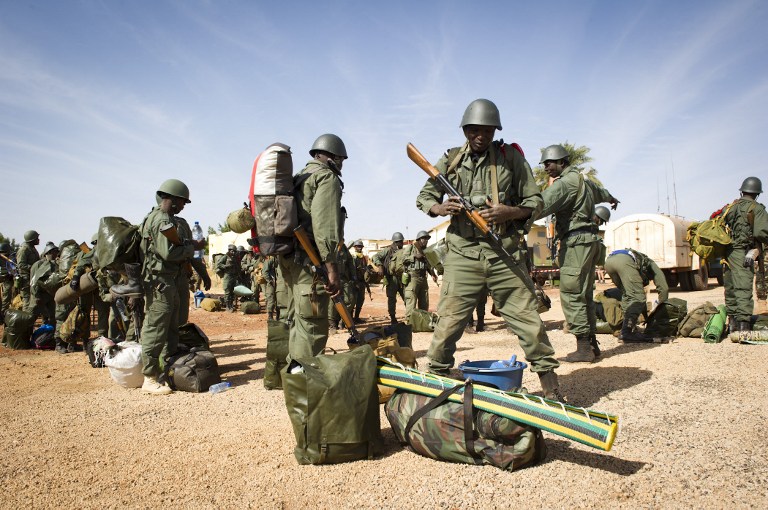 This handout picture released and taken on January 27, 2013 by the French Army Communications Audiovisual office (ECPAD) shows Malian soldiers lining up to embark on French army transport bound for Gao on January 26, 2013 in Sevare. AFP PHOTO / ECPAD / GHISLAIN MARIETTE