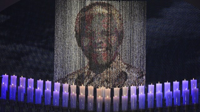 FINAL FAREWELL. Candles are lit under a portrait of Neslon Mandela before the funeral ceremony of South African former president Nelson Mandela in Qunu on December 15, 2013.  AFP / Pool / Odd Andersen