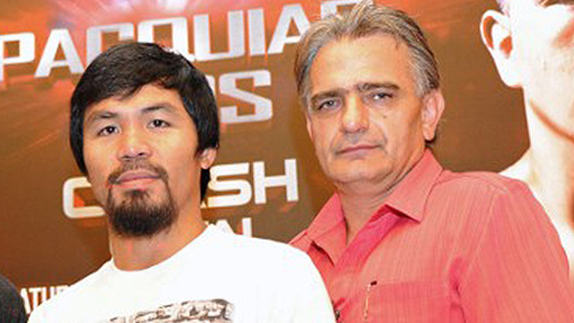 FRIENDS. Boxing champ Manny Pacquiao sticks to financial advisor Michael Koncz. Photo by Mohd Fyrol/AFP