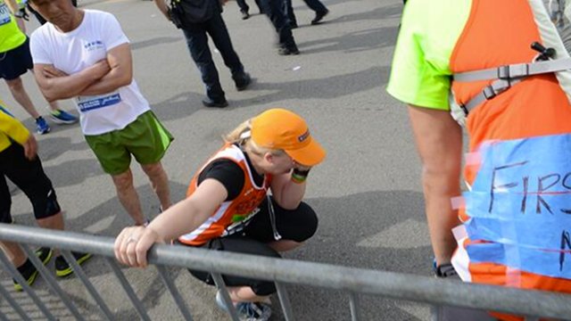 HEARTBREAK. A runner breaks down at the Boston Marathon after two bombs exploded at the finish line. Photo from Twitter user @bcheights