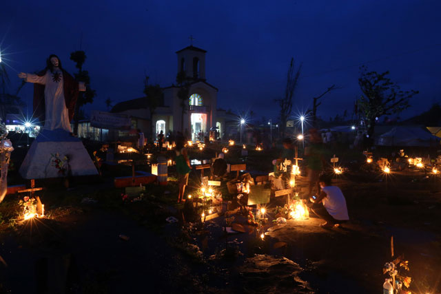 BURIAL, FINALLY. Rehabilitation czar Panfilo Lacson says the government finally began burying the bodies left in open fields nearly two months since Super Typhoon Yolanda (Haiyan). File December 25, 2013 photo by Dennis Sabangan/EPA