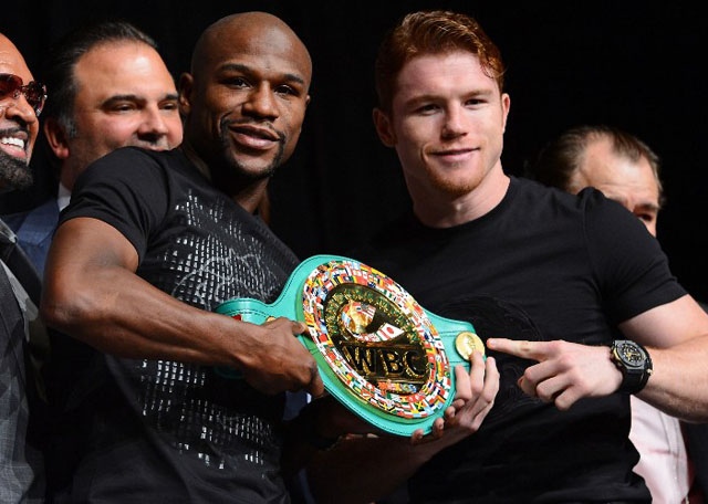 NO SMILES ON SUNDAY. Mayweather and Alvarez battle for the WBC and WBA crowns. Photo by AFP.