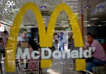 FAST-FOOD: Indian customers partake of food at a McDonalds outlet in New Delhi. US fast-food giant McDonald's, famed for its beef-based Big Mac burgers, said on September 4 that it will open its first vegetarian-only restaurant anywhere in the world in India next year. Photo from AFP