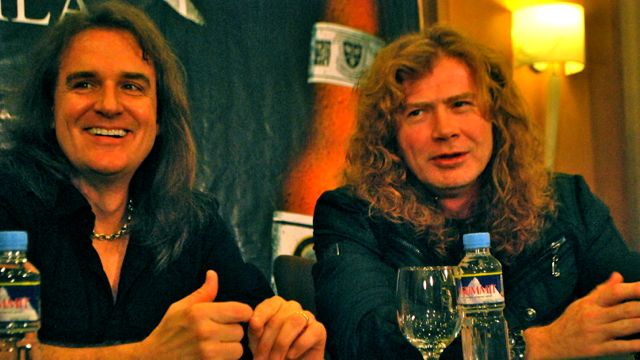 MUSTAINE (right) CONVERTED TO BORN again Christianism 'but nothing's changed.' With him in photo is David Ellefson. Photo by Pauline Balba