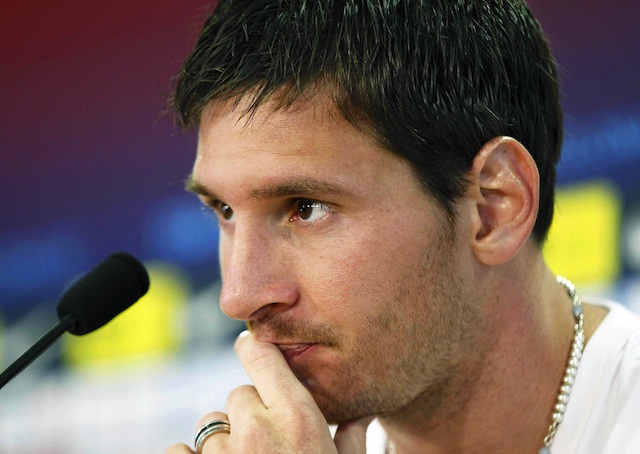 FRAUD? Lionel Messi and his father are being charged with tax fraud.  A file picture dated 18 July 2012 shows FC Barcelona's Argentinean forward Lionel Messi during a press conference following his team's training session in Barcelona's sport complex in Sant Joan Despi, Barcelona, Spain. Photo by Andreu Dalmau/EPA