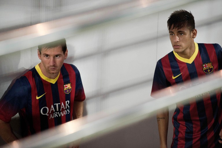 DYNAMIC DUO? FC Barcelona's Lionel Messi (L) and Neymar (R) are seen in a corridor before entering the pitch to play their exhibition match against Thailand's national football team at the Rajamangala football stadium in Bangkok on August 6, 2013. AFP/ Nicolas Asfouri