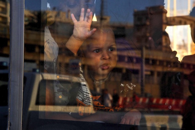 NOT PAWNS. Pope Francis said countries should work to protect migrants and refugees. In this photo, a migrant child sits inside a vehicle after arriving at the port of Reggio Calabria, southern Italy, 17 August 2013 aboard an Italian coast guard vessel. EPA/Franco Cufari