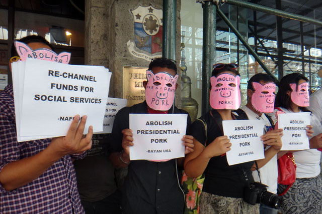 NEW YORK PROTEST. Filipino-American activists wearing masks of pigs stage a protest in front of the Philippine consulate on 5th Avenue in New York City to protest against the corruption of pork barrel back in the Philippines. Photo by Cristina DC Pastor
