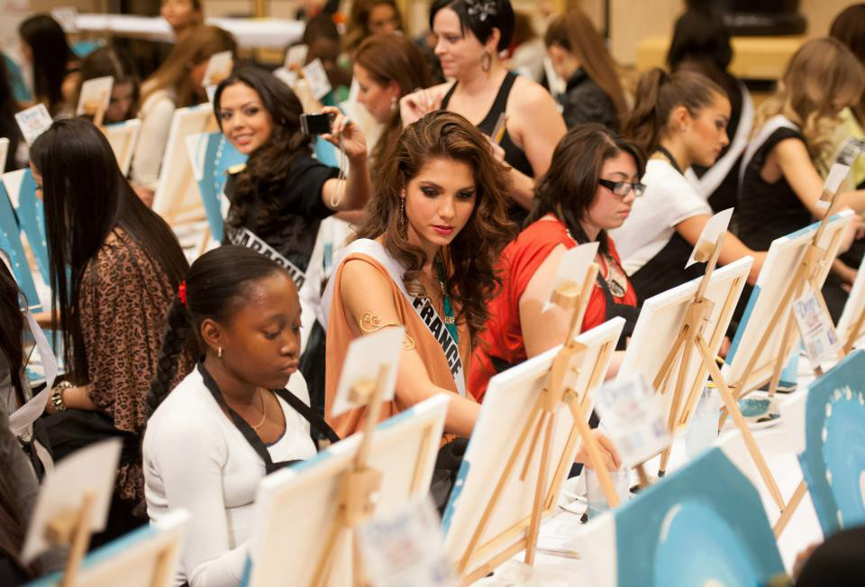 Miss France Marie Payet and the others hard at work on their artwork. Photo courtesy of the Miss Universe Organization LP, LLLP