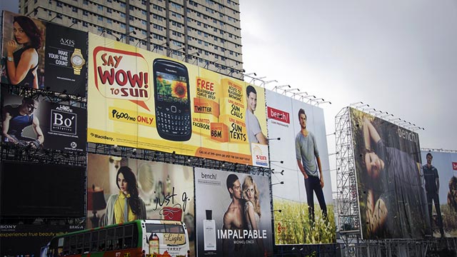SIGNAL NO. 1. MMDA Chairman Francis Tolentino orders billboard owners to take down ads before Gorio hits Metro Manila on Sunday. Photo via NZGMW / Shutterstock.com