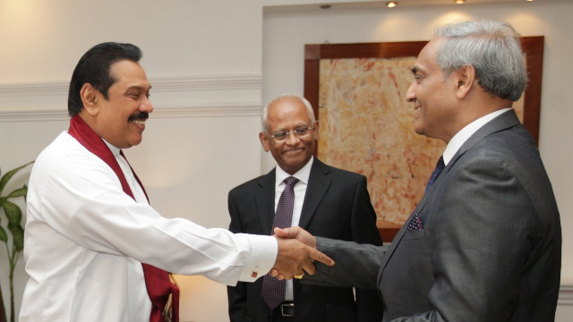 APPOINTED. President Mahinda Rajapakse (left) shakes hands with Mohan Peiris after appointing him chief justice on January 15. Photo from AFP