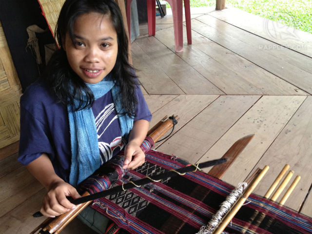 NEXT GENERATION. Weavers at Ock Pop Tock, like Mone (pictured), help carry on the tradition and benefit economically from sales