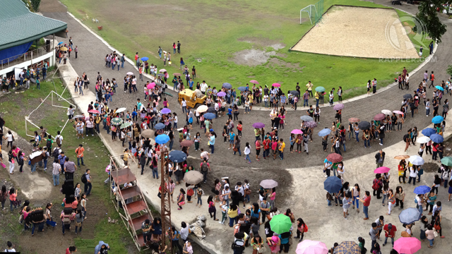 TO SAFETY. Students at the University of St La Salle in Bacolod City congregate at the school's athletic field after a magnitude 5.8 earthquake shook the Visayas, November 14, 2012. Photo by Michael Josh Villanueva.