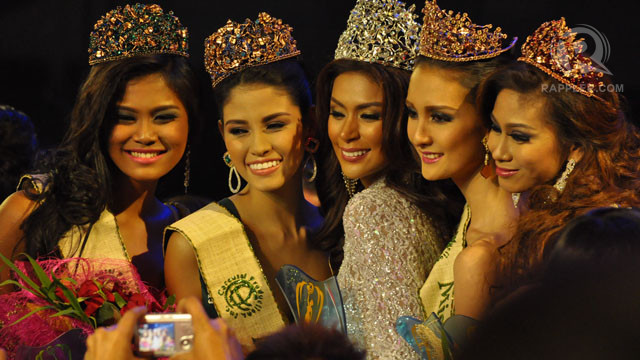 CROWNED AND PROUD. The night's winning ladies smile for hundreds of cameras