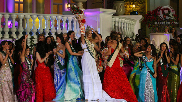 Miss Czech Republic held on to her crown to keep it from falling off because of the wind
