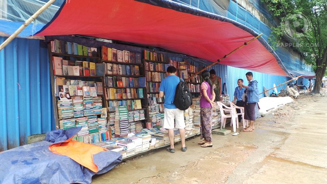 READING CULTURE. Makeshift bookstores sell books on the streets of Yangon. Books vary from secondhand novels to photocopied reference materials. Photo by Rappler, Ayee Macaraig/2013 SEAPA Fellow 