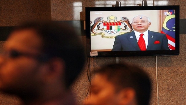 MALAYSIAN PARLIAMENT. Malaysian Prime Minister Najib Razak announces the dissolution of Parliament as he addresses the nation during a live telecast from the Prime Minister's Department office in Putrajaya on April 3, 2013. Najib dissolved parliament clearing the way for elections seen as the toughest challenge to the ruling coalition's 56 years in power. AFP PHOTO / MOHD RASFAN