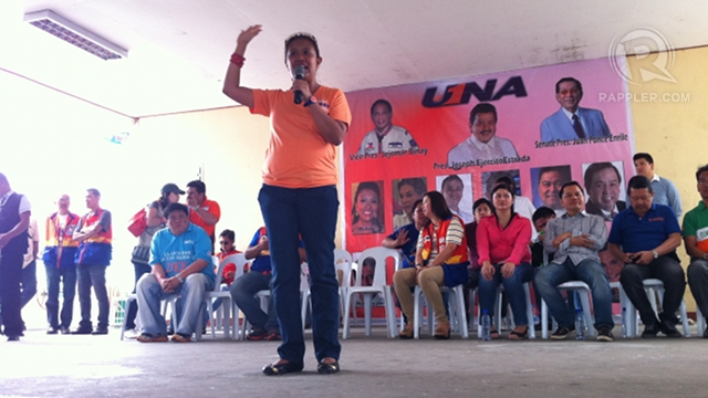 'REMEMBER ME.' Nancy Binay does the high-five to help voters in Mabalacat, Pampanga remember her ballot number. Photo by Ayee Macaraig.