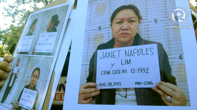 MUGSHOTS: Police officers show the mugshots of Janet Lim Napoles. Photo by Paterno Esmaquel/Rappler