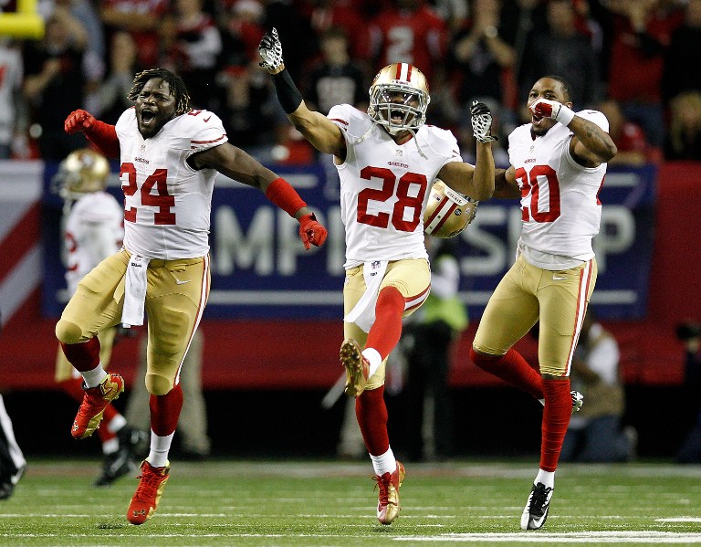 JUMP FOR JOY. Anthony Dixon #24, defensive back Darcel McBath #28 and defensive back Perrish Cox #20 of the San Francisco 49ers react after stopping the Atlanta Falcons on fourth down in the fourth quarter in the NFC Championship game at the Georgia Dome on January 20, 2013 in Atlanta, Georgia. Chris Graythen/Getty Images/AFP