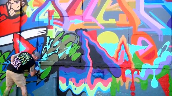 A GRAFFITI ARTIST WORKS on a project at the 5Pointz Aerosol Art Center, Inc. Screen grab from YouTube (ROCKETBOOM)