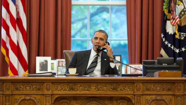 FRIENDLY CHAT. President Barack Obama talks with President Hassan Rouhani of Iran during a phone call in the Oval Office signaling a dramatic moment in US-Iranian ties. Photo credit: AFP/The White House/Pete Souza