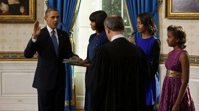 SECOND TERM. US Supreme Court Chief Justice John Roberts administers the oath of office to President Barack Obama during the official swearing-in ceremony in the Blue Room of the White House on Inauguration Day, Sunday, Jan 20, 2013. First Lady Michelle Obama, holding the Robinson family Bible, along with daughters Malia and Sasha, stand with the President. (Official White House Photo by Lawrence Jackson)
