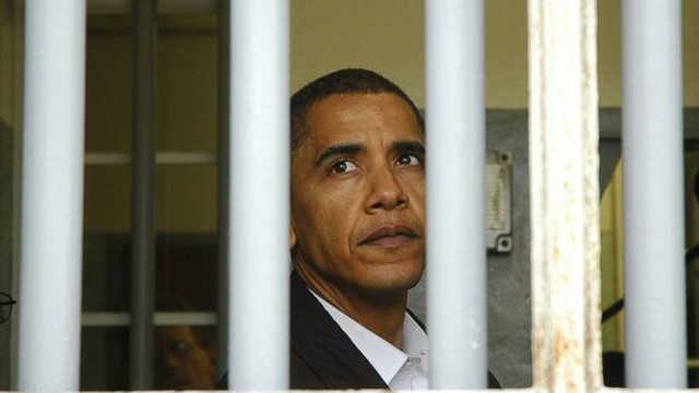 VISIT. US President Barack Obama looks out of the window of the cell where Nelson Mandela was imprisoned, at Robben Island. Photo from AFP