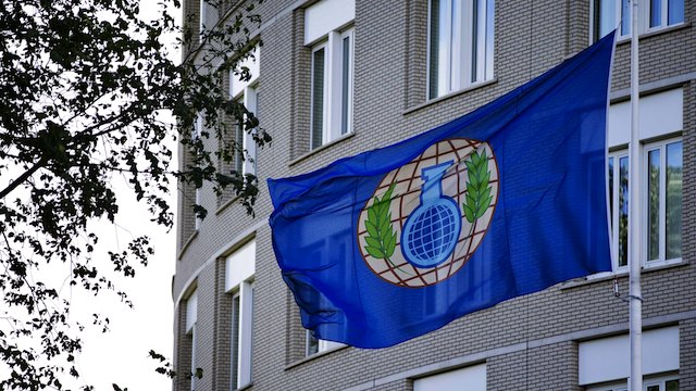 A file picture dated 31 August 2013 shows the flag of the Organization for the Prohibition of Chemical Weapons (OPCW) in front of their building in The Hague, The Netherlands. EPA/Guus Schonewille