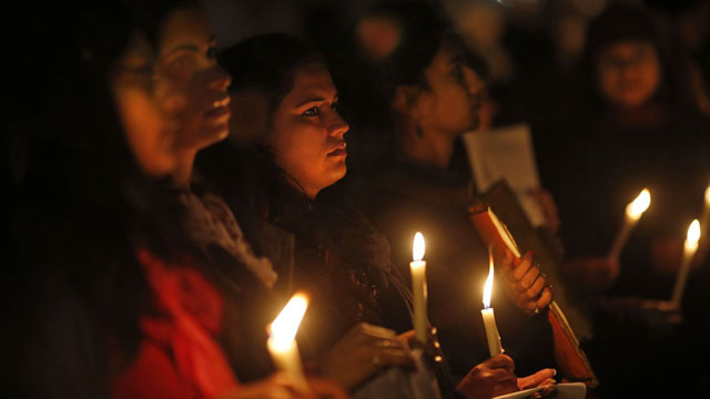 Indians hold a candle light vigil to salute the undying spirit of a rape victim and to mourn her death in New Delhi, India , Sunday, Dec. 30, 2012. The young woman who died after being gang-raped and beaten on a bus in India's capital was cremated Sunday amid an outpouring of anger and grief by millions across the country demanding greater protection for women from sexual violence. (AP Photo/ Saurabh Das)