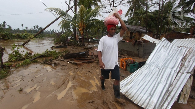 RESIDENTS HIT. Over 50,000 flee their homes due to Typhoon Pablo. Photo by Karlos Manlupig