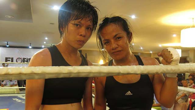 GIRL POWER. Jessebelle Pagaduan (right) became the first female boxer to be crowned national champion in the Philippines when she won the GAB female minimumweight title this year. Photo by Ryan Songalia/Rappler