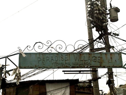 PARADISE LOST. The entrance to Paradise Village indicates what lies inside. Photo by Nikki Luna