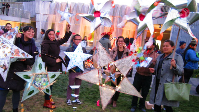 UNITED. Filipinos in the city join the festivities by making their own star lanterns