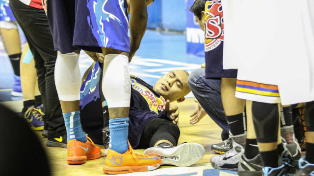 Rain or Shine's Paul Lee struggles to get up after a hard collision. Photo by Nuki Sabio/PBA Images