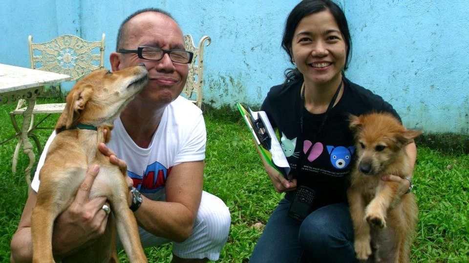 ALL THE LOVE IN THE WORLD. Dogs Phil and James were happy to be adopted by acclaimed filmmaker Joey Reyes in 2011. They are pictured with PAWS's Anna Cabrera (right). Photo from the PAWS Facebook page