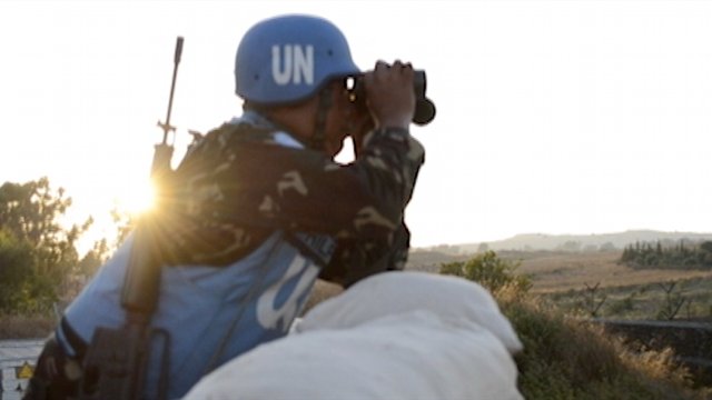 WORTH THE RISK. Filipino peacekeepers in Golan Heights face the daily dangers, like land mines, unfriendly fire and abduction but Ecarma says the risk is worth it. Photo by Frank Sayson.