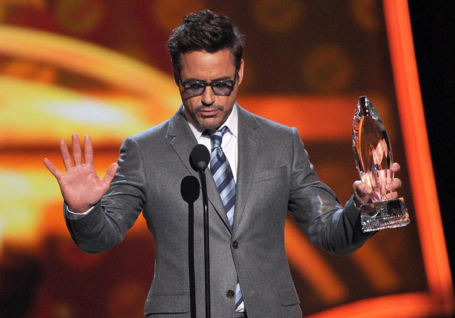 IRON MAN HAS LANDED. Robert Downey Jr does an Iron Man pose while accepting the award for Favorite Superhero. The actor also received the award for Favorite Movie Actor. Photo from the People's Choice Awards Facebook page