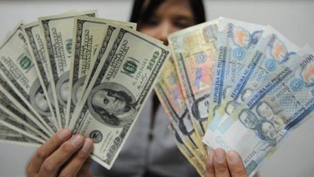 REMITTANCE INFLOWS. Filipinos overseas sent over $5 billion in the January to March period in 2013. Photo by AFP